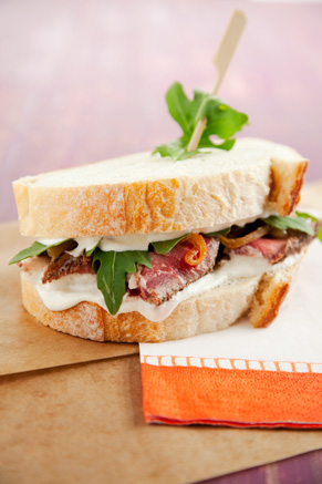 Prime Rib Sandwich with Caramelized Onions, Arugula and Horseradish Cream Thumbnail